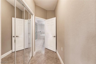 Discover this stunning first-floor coach home offering on Verandah Golf Course and Club in Florida - for sale on GolfHomes.com, golf home, golf lot