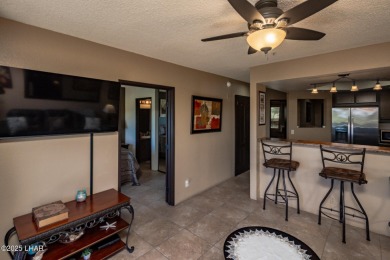 Desirable View Condo at Queensbay! This stunning lake-view condo on London Bridge Golf Course in Arizona - for sale on GolfHomes.com, golf home, golf lot