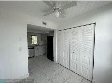 PRESENTING A WOW PROPERTY. BEAUTIFULLY SECOND FLOOR CONDO WITH on Oriole Golf and Tennis Club in Florida - for sale on GolfHomes.com, golf home, golf lot