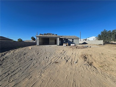 Brand new construction by Castro Construction in Fort Mohave, AZ on Los Lagos Golf Club in Arizona - for sale on GolfHomes.com, golf home, golf lot