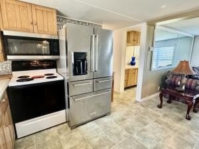Well maintained manufactured home in active  age 55+ community on Cypress Creek Country Club - Boynton Beach in Florida - for sale on GolfHomes.com, golf home, golf lot