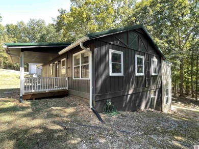 A circular concrete drive brings you to this darling home. It on  in Kentucky - for sale on GolfHomes.com, golf home, golf lot