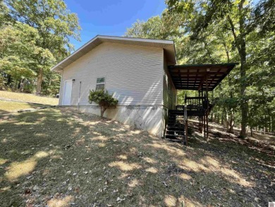 A circular concrete drive brings you to this darling home. It on  in Kentucky - for sale on GolfHomes.com, golf home, golf lot
