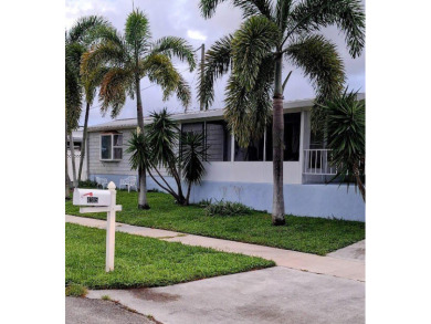 Well maintained manufactured home in active  age 55+ community on Cypress Creek Country Club - Boynton Beach in Florida - for sale on GolfHomes.com, golf home, golf lot