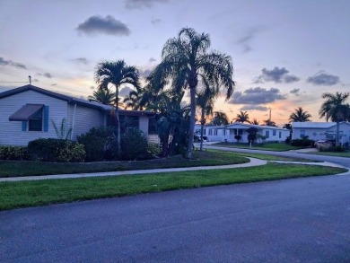 Well maintained manufactured home in active  age 55+ community on Cypress Creek Country Club - Boynton Beach in Florida - for sale on GolfHomes.com, golf home, golf lot