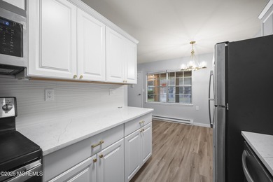 Step into this beautifully remodeled 2-bedroom, 1-bath condo in on Greenbriar Woodlands in New Jersey - for sale on GolfHomes.com, golf home, golf lot