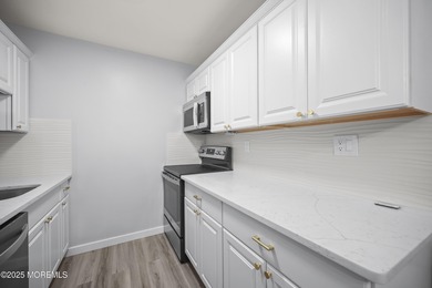 Step into this beautifully remodeled 2-bedroom, 1-bath condo in on Greenbriar Woodlands in New Jersey - for sale on GolfHomes.com, golf home, golf lot