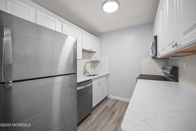 Step into this beautifully remodeled 2-bedroom, 1-bath condo in on Greenbriar Woodlands in New Jersey - for sale on GolfHomes.com, golf home, golf lot