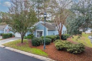 This exceptional residence boasts a spacious two-car garage and on Okatie Creek Golf Club in South Carolina - for sale on GolfHomes.com, golf home, golf lot