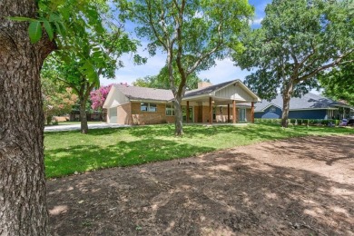 Welcome to your dream home in the heart of one of the city's on The Lake Country Club - Lake Waco in Texas - for sale on GolfHomes.com, golf home, golf lot