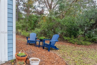 This exceptional residence boasts a spacious two-car garage and on Okatie Creek Golf Club in South Carolina - for sale on GolfHomes.com, golf home, golf lot