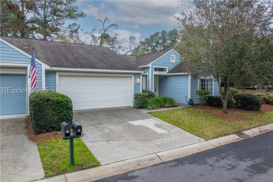 This exceptional residence boasts a spacious two-car garage and on Okatie Creek Golf Club in South Carolina - for sale on GolfHomes.com, golf home, golf lot