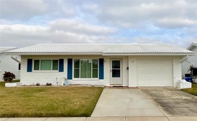 This home has  2-bedrooms, 2-bathrooms, 1,129 square feet and a on Mainlands Golf Club in Florida - for sale on GolfHomes.com, golf home, golf lot
