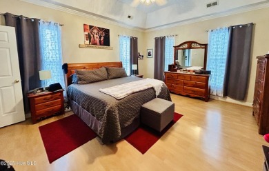 You wont want to miss this bright and airy 5 bedroom, 2 1/2 bath on Rock Creek Country Club in North Carolina - for sale on GolfHomes.com, golf home, golf lot