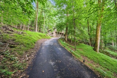 Just inside the gated entrance, 810 Little Pine Mountain Road is on Bent Tree Golf Course in Georgia - for sale on GolfHomes.com, golf home, golf lot