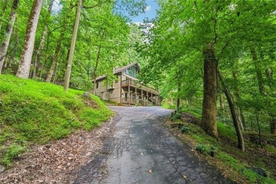 Just inside the gated entrance, 810 Little Pine Mountain Road is on Bent Tree Golf Course in Georgia - for sale on GolfHomes.com, golf home, golf lot