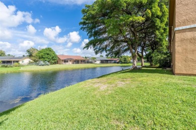FHA AND LOW DOWNPAYMENT AVAILABLE! CORNER UNIT AND WATERVIEWS on Woodmont Country Club in Florida - for sale on GolfHomes.com, golf home, golf lot
