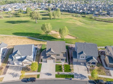 Welcome to this stunning two-story home that backs to Green on Green Valley Ranch Golf Club in Colorado - for sale on GolfHomes.com, golf home, golf lot