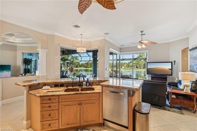 Step into a refined coastal retreat where panoramic lake views on Lely Resort Golf and Country Club in Florida - for sale on GolfHomes.com, golf home, golf lot