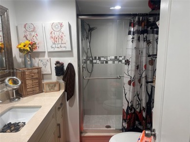 This beautifully remodeled 2 bedroom 2 bath condo is located in on Sunrise Lakes Phase IV Golf Course in Florida - for sale on GolfHomes.com, golf home, golf lot