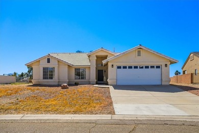 Welcome to 1976 Desert Greens Dr in Fort Mohave AZ, where on Desert Lakes Golf Course in Arizona - for sale on GolfHomes.com, golf home, golf lot