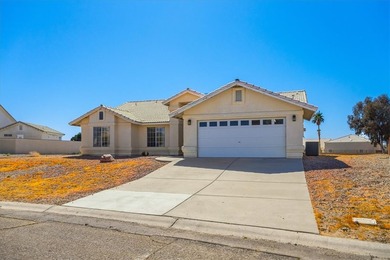 Welcome to 1976 Desert Greens Dr in Fort Mohave AZ, where on Desert Lakes Golf Course in Arizona - for sale on GolfHomes.com, golf home, golf lot
