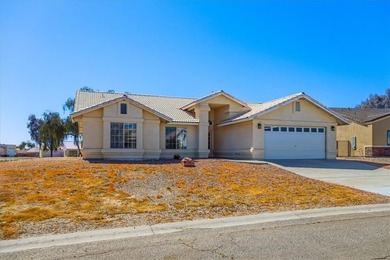 Welcome to 1976 Desert Greens Dr in Fort Mohave AZ, where on Desert Lakes Golf Course in Arizona - for sale on GolfHomes.com, golf home, golf lot