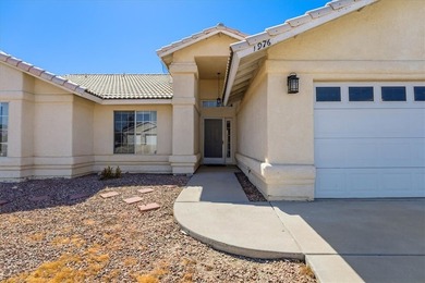 Welcome to 1976 Desert Greens Dr in Fort Mohave AZ, where on Desert Lakes Golf Course in Arizona - for sale on GolfHomes.com, golf home, golf lot