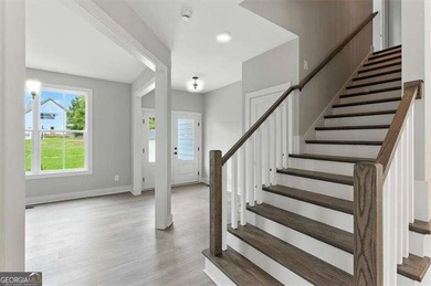 Welcome Home to 29 Creekview Drive! This stunning Alexander on The Plantation Golf Club in Georgia - for sale on GolfHomes.com, golf home, golf lot