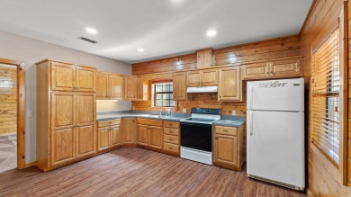 This stunning log cabin, located just moments from Yarborough on  in Arkansas - for sale on GolfHomes.com, golf home, golf lot