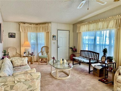 Lovely 2-bedroom, 2 bath home with 2 outdoor living spaces on Indianwood Golf and Country Club in Florida - for sale on GolfHomes.com, golf home, golf lot