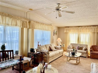 Lovely 2-bedroom, 2 bath home with 2 outdoor living spaces on Indianwood Golf and Country Club in Florida - for sale on GolfHomes.com, golf home, golf lot