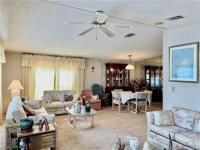 Lovely 2-bedroom, 2 bath home with 2 outdoor living spaces on Indianwood Golf and Country Club in Florida - for sale on GolfHomes.com, golf home, golf lot