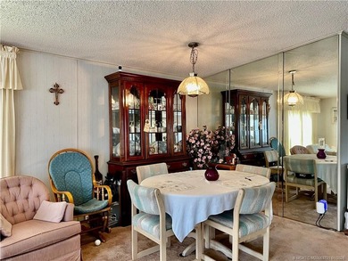 Lovely 2-bedroom, 2 bath home with 2 outdoor living spaces on Indianwood Golf and Country Club in Florida - for sale on GolfHomes.com, golf home, golf lot