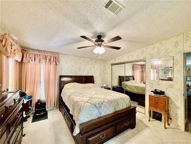 Lovely 2-bedroom, 2 bath home with 2 outdoor living spaces on Indianwood Golf and Country Club in Florida - for sale on GolfHomes.com, golf home, golf lot