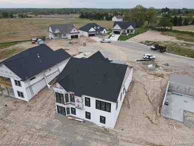 Experience the unparalleled lifestyle of living in a premier on Metamora Country Club in Michigan - for sale on GolfHomes.com, golf home, golf lot