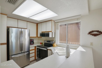 Ground floor 2 bedroom, 2 bath condo with a 1-car garage, being on London Bridge Golf Course in Arizona - for sale on GolfHomes.com, golf home, golf lot