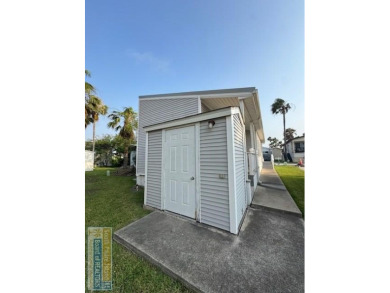This extremely spacious park model with island room has lots of on Long Island Golf Course in Texas - for sale on GolfHomes.com, golf home, golf lot