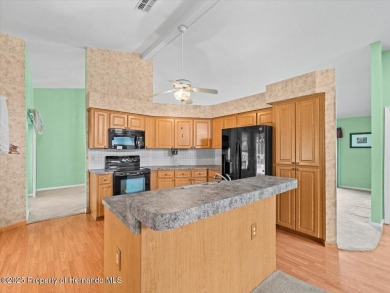 Spacious 3/2/2 well-maintained pool home with split floor plan on Seven Hills Golfers Club in Florida - for sale on GolfHomes.com, golf home, golf lot