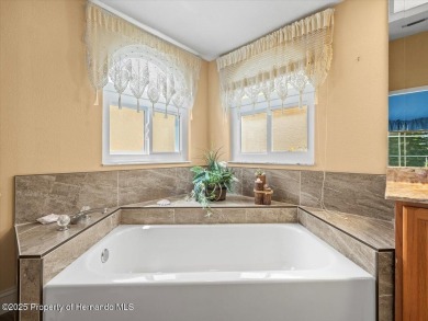 Spacious 3/2/2 well-maintained pool home with split floor plan on Seven Hills Golfers Club in Florida - for sale on GolfHomes.com, golf home, golf lot