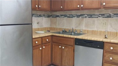 Amazing waterfront unit overlooking the canal and golf course! on Inverrary Country Club in Florida - for sale on GolfHomes.com, golf home, golf lot