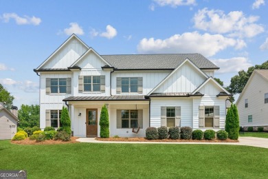 Imagine waking up to stunning views of the green, enjoying your on Traditions of Braselton Golf Club in Georgia - for sale on GolfHomes.com, golf home, golf lot