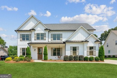 Imagine waking up to stunning views of the green, enjoying your on Traditions of Braselton Golf Club in Georgia - for sale on GolfHomes.com, golf home, golf lot