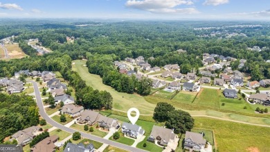 Imagine waking up to stunning views of the green, enjoying your on Traditions of Braselton Golf Club in Georgia - for sale on GolfHomes.com, golf home, golf lot