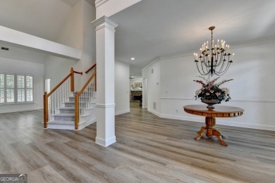 Discover a meticulously designed home that seamlessly blends on Canongate At Olde Atlanta Golf Club in Georgia - for sale on GolfHomes.com, golf home, golf lot