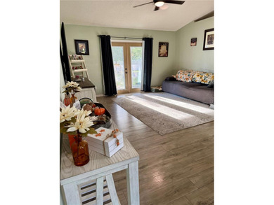 Check out this beautifully maintained home nestled in the on The Grand Club - Pine Lakes Course in Florida - for sale on GolfHomes.com, golf home, golf lot