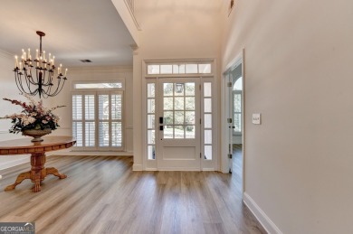 Discover a meticulously designed home that seamlessly blends on Canongate At Olde Atlanta Golf Club in Georgia - for sale on GolfHomes.com, golf home, golf lot