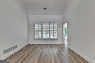 Discover a meticulously designed home that seamlessly blends on Canongate At Olde Atlanta Golf Club in Georgia - for sale on GolfHomes.com, golf home, golf lot