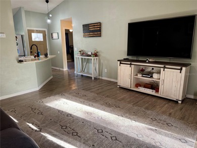 Check out this beautifully maintained home nestled in the on The Grand Club - Pine Lakes Course in Florida - for sale on GolfHomes.com, golf home, golf lot