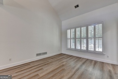 Discover a meticulously designed home that seamlessly blends on Canongate At Olde Atlanta Golf Club in Georgia - for sale on GolfHomes.com, golf home, golf lot